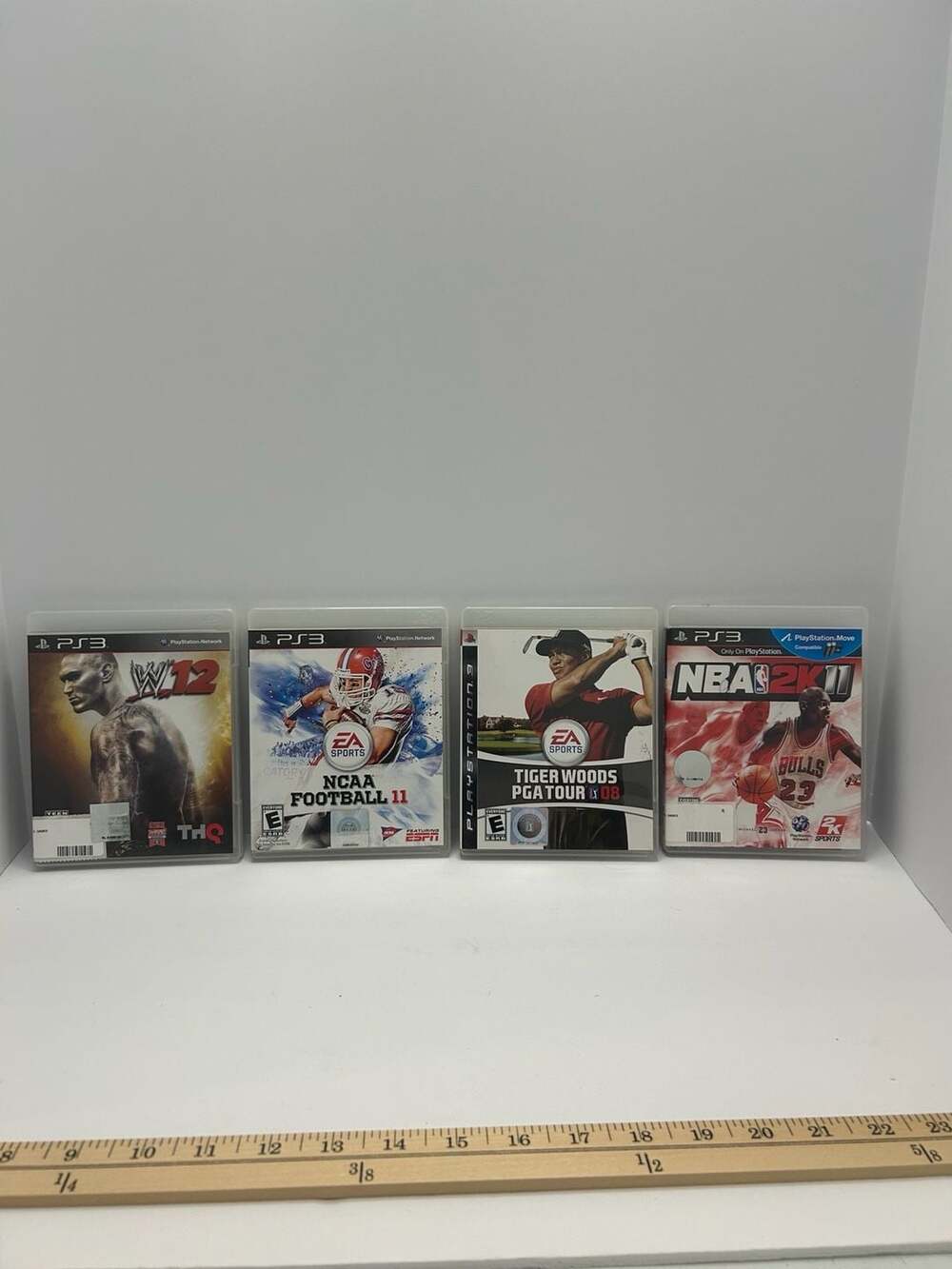 Lot of 4 PlayStation 3 Games: WWE '12, NCAA Football 11, Tiger Woods PGA Tour 08